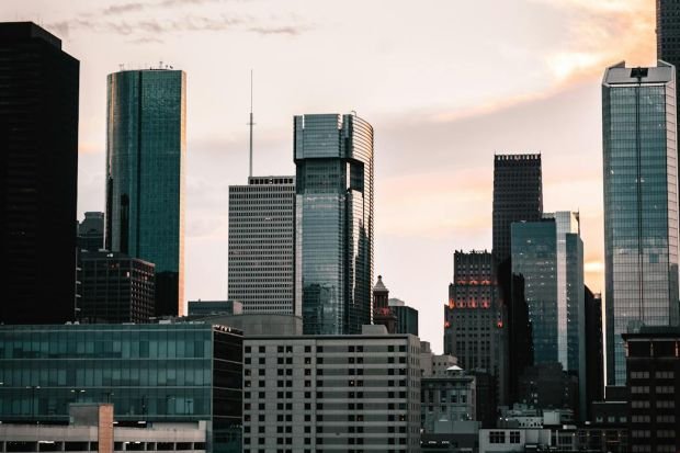 Captivating view of Houston's skyline at sunset, showcasing modern skyscrapers and urban architecture.