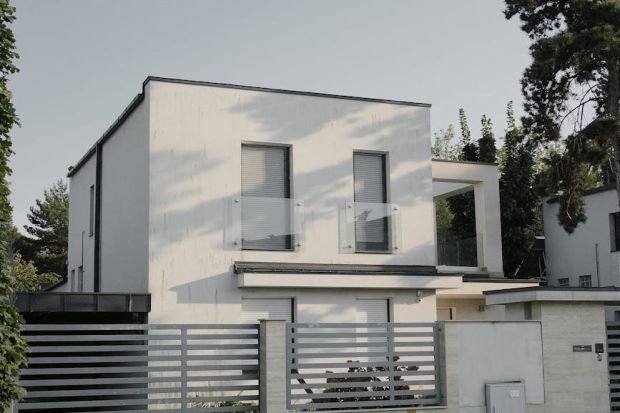 Elegant minimalist architecture of a modern home in Hungary, surrounded by nature.