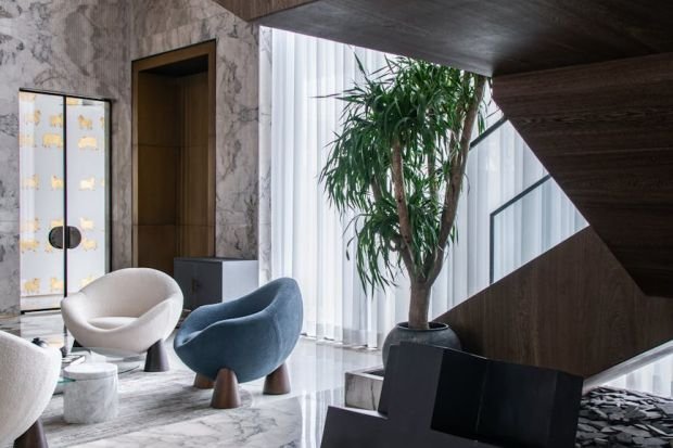 Stylish living space featuring contemporary furniture and marble textures.